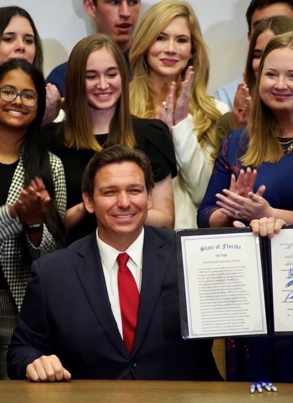 The April 2022 signing of SB 7044, Florida’s postsecondary education bill, with Ashley Bell Barnett among those gathered